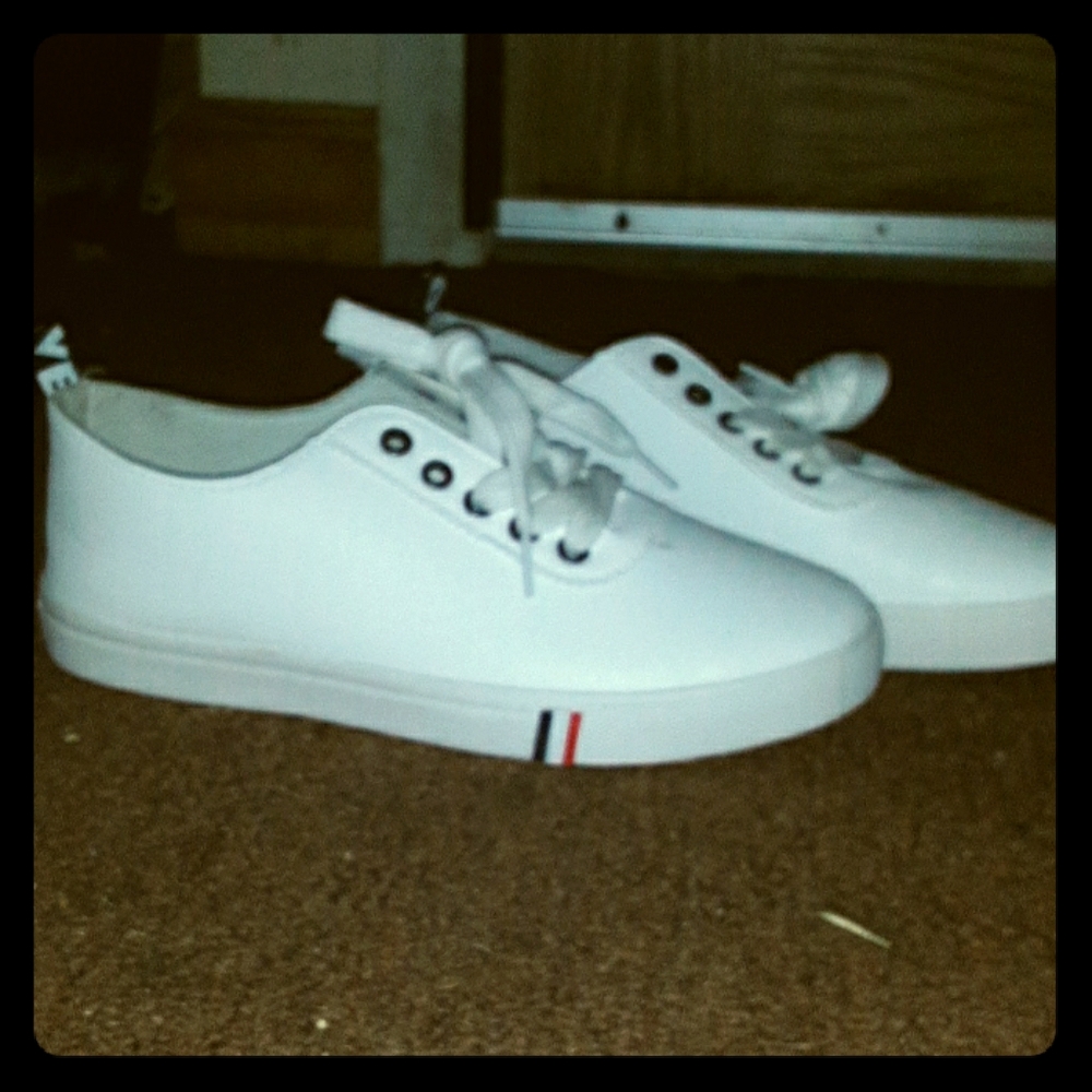 Brand new white tena shoes.